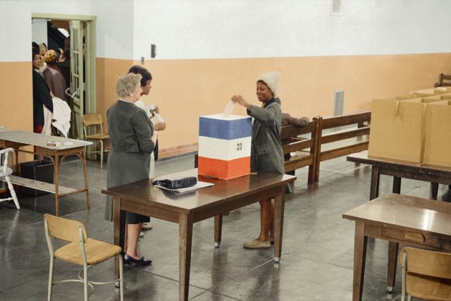 2024 Taiwan Election Exposes Deep Political Fractures in Three-Way Race Voters cast ballots at a polling station in Taiwan during the 2024 presidential election.