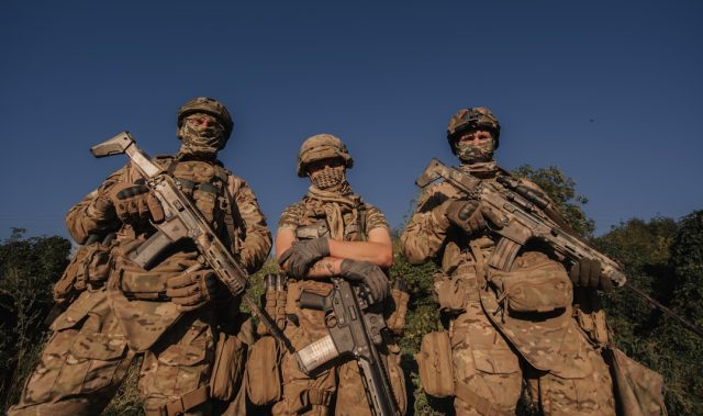 Pakistan Army Casualties in Zhob Expose Ongoing Border Security Challenges Pakistani soldiers patrol a rugged border area near Zhob, with mountains visible in the background.