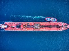 Iraq Oil Tanker Attack Kills One, Ignites Supply Fears Two burning tankers billow black smoke near an Iraqi port as rescue boats approach the stricken vessels.