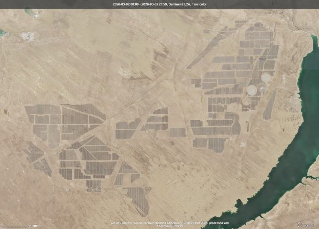 Talatan Solar Park Aerial view of the Talatan Solar Park's vast array of solar panels stretching across the Tibetan Plateau in Qinghai Province, China.
