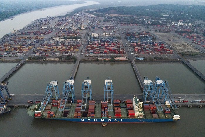 Two suspects at large in container trading fraud that led to arrest of ex-officer’s son